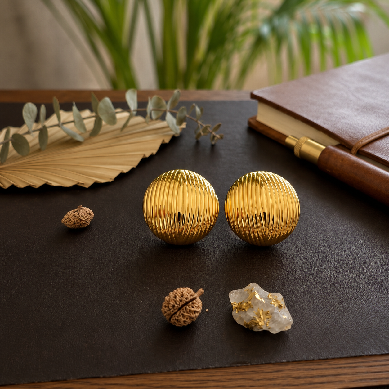 Flaire Studio ribbed gold ball stud earrings worn on model
